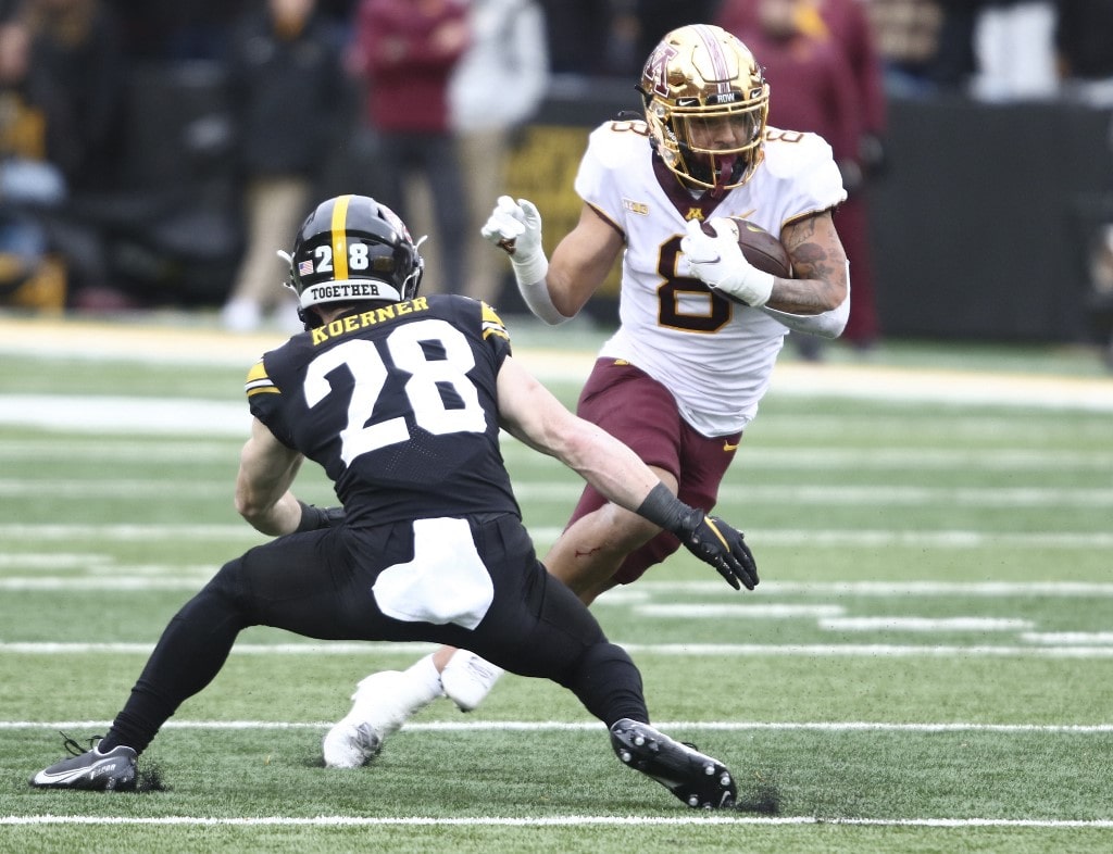 Trey Potts of the Minnesota Golden Gophers runs up the field in the